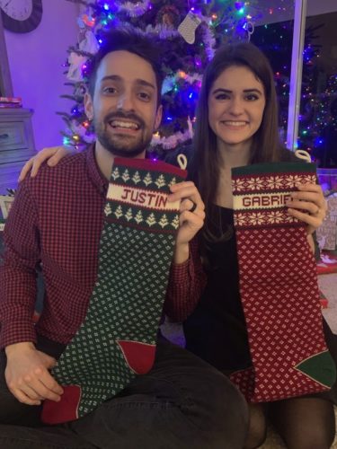 two people with Christmas Stockings